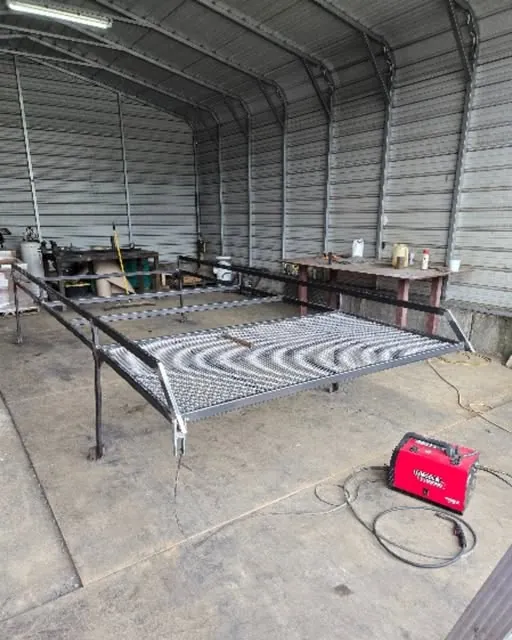 Large welded steel frame with an expanded-metal surface in the fabrication shop