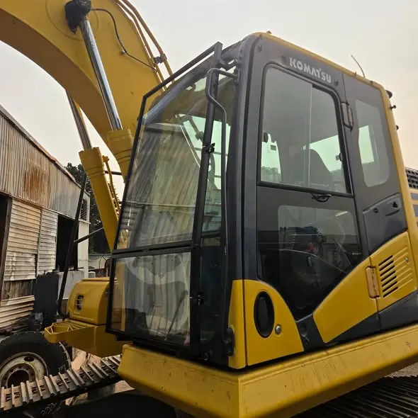 Custom fabricated window shield on heavy equipment